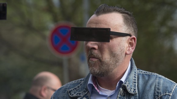 DRESDEN, GERMANY - APRIL 19: Lutz Bachmann, wearing black glasses, founder of the Pegida movement, arrives for the first day of his trial to face charges of hate speech on April 19, 2016 in Dresden, G ...