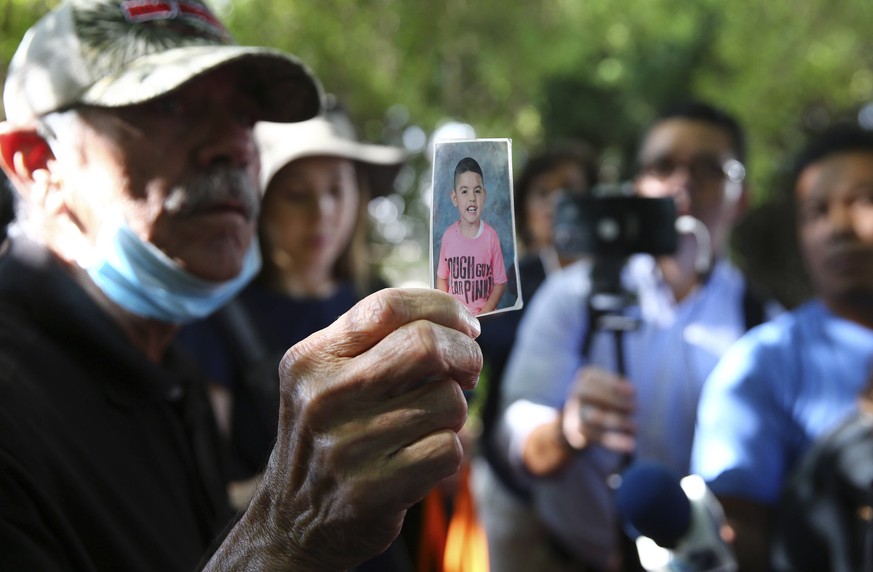 May 26, 2022, Uvalde, Texas, USA: George Rodriguez holds up a picture of his grandson, Jose Flores, Jr., who perished with 20 other victims of the Robb Elementary School shooting in Uvalde, Texas on T ...