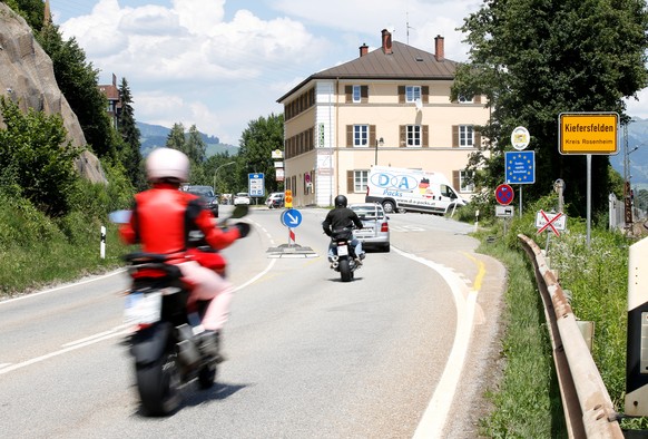 Traffic signs are seen at a street between Kiefersfelden and the Austrian city Kufstein, Germany June 21, 2018. Picture taken June 21, 2018. REUTERS/Michaela Rehle