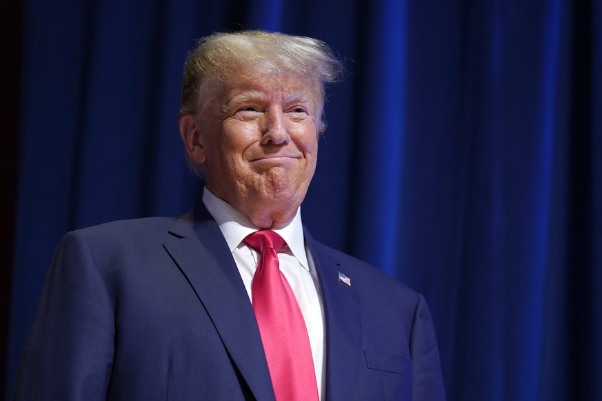 Former President Donald Trump smiles as he arrives on stage to speak during the North Carolina Republican Party Convention in Greensboro, N.C., Saturday, June 10, 2023. (AP Photo/Chuck Burton)