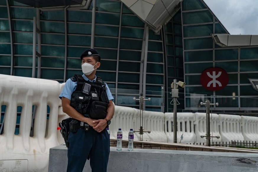 HONG KONG, CHINA - JUNE 30: A police officer stands guard outside the West Kowloon High Speed Rail Station ahead of President Xi Jinping&#039;s arrival on June 30, 2022 in Hong Kong, China. Hong Kong  ...