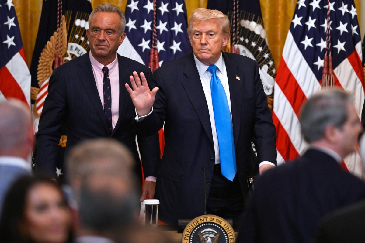 President Donald Trump and Health and Human Service Secretary Robert F. Kennedy, Jr., left, depart after speaking at an event in the East Room of the White House, Wednesday, July 30, 2025, in Washingt ...
