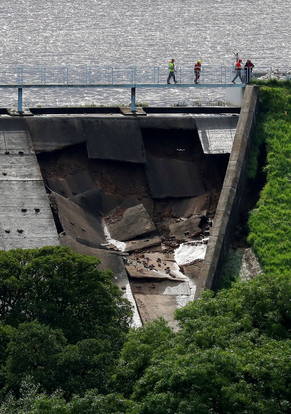 A damaged dam is seen after a nearby reservoir was affected by flooding, in Whaley Bridge, Britain August 1, 2019. REUTERS/Phil Noble