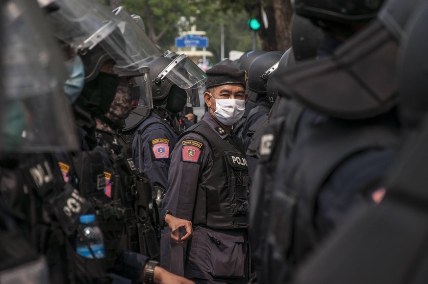 February 7, 2021, Bangkok, Thailand: Riot police stand on guard outside the United Nation building during the demonstration..Myanmar protesters rally outside The United Nation building UN in Bangkok a ...