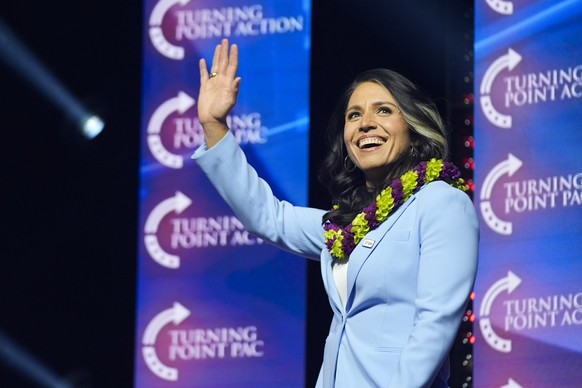 FILE - Former Democratic Rep. Tulsi Gabbard waves as she arrives to speak before Republican presidential nominee former President Donald Trump during a campaign rally at Thomas &amp; Mack Center, Oct. ...