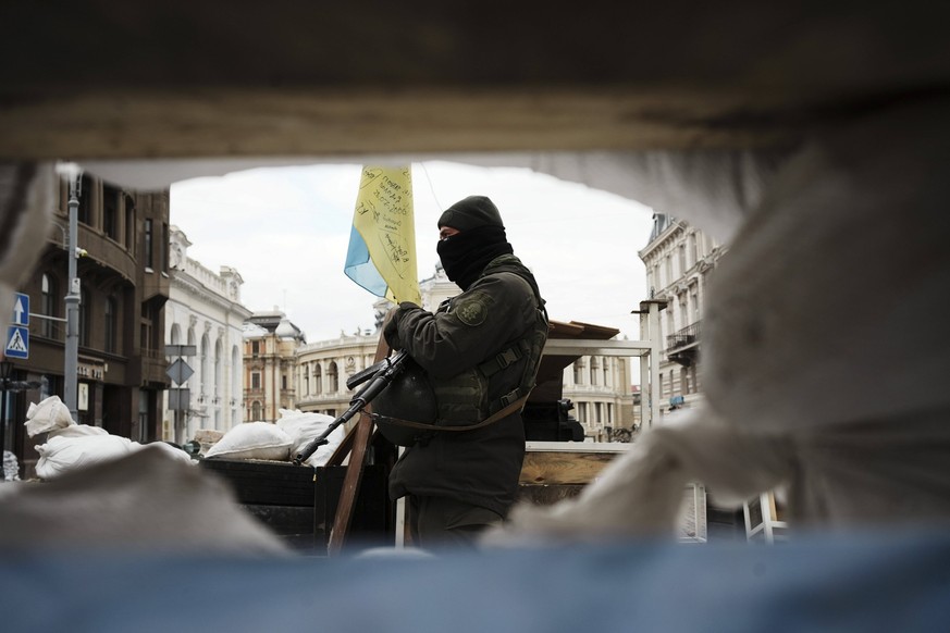 An soldier patrols next to a trench in Odessa, Ukraine, 14 March 2022 issued on 15 March 2022. The port city in southwestern Urkaine prepares for the arrival of Russian troops amid the military invasi ...