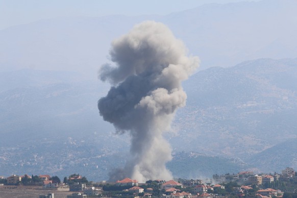 240930 -- KHIYAM LEBANON, Sept. 30, 2024 -- Smoke rises following an Israeli airstrike in the town of Khiyam, southeastern Lebanon, on Sept. 30, 2024. A total of 95 people were killed and 172 others i ...