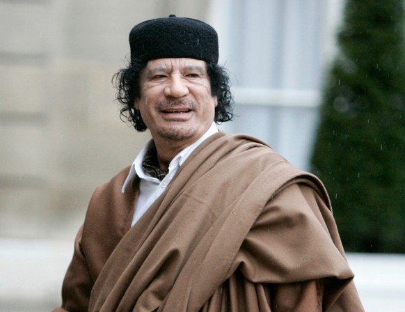 FILE - In this Dec. 10 2007 file photo, then French President Nicolas Sarkozy, left, greets then Libyan leader Col. Moammar Gadhafi upon his arrival at the Elysee Palace, in Paris. Moftah Missouri, wh ...