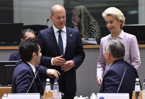 German Chancellor Olaf Scholz, second left, and European Commission President Ursula von der Leyen, right, speak with Hungary's Prime Minister Viktor Orban, second right, and Bulgaria's Prime Minister ...