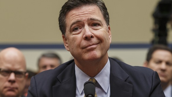 FILE - In this file July 7, 2016, photo then-FBI Director James Comey testifies before the House Oversight Committee to discuss Hillary Clinton's email investigation, at the Capitol in Washington. The ...