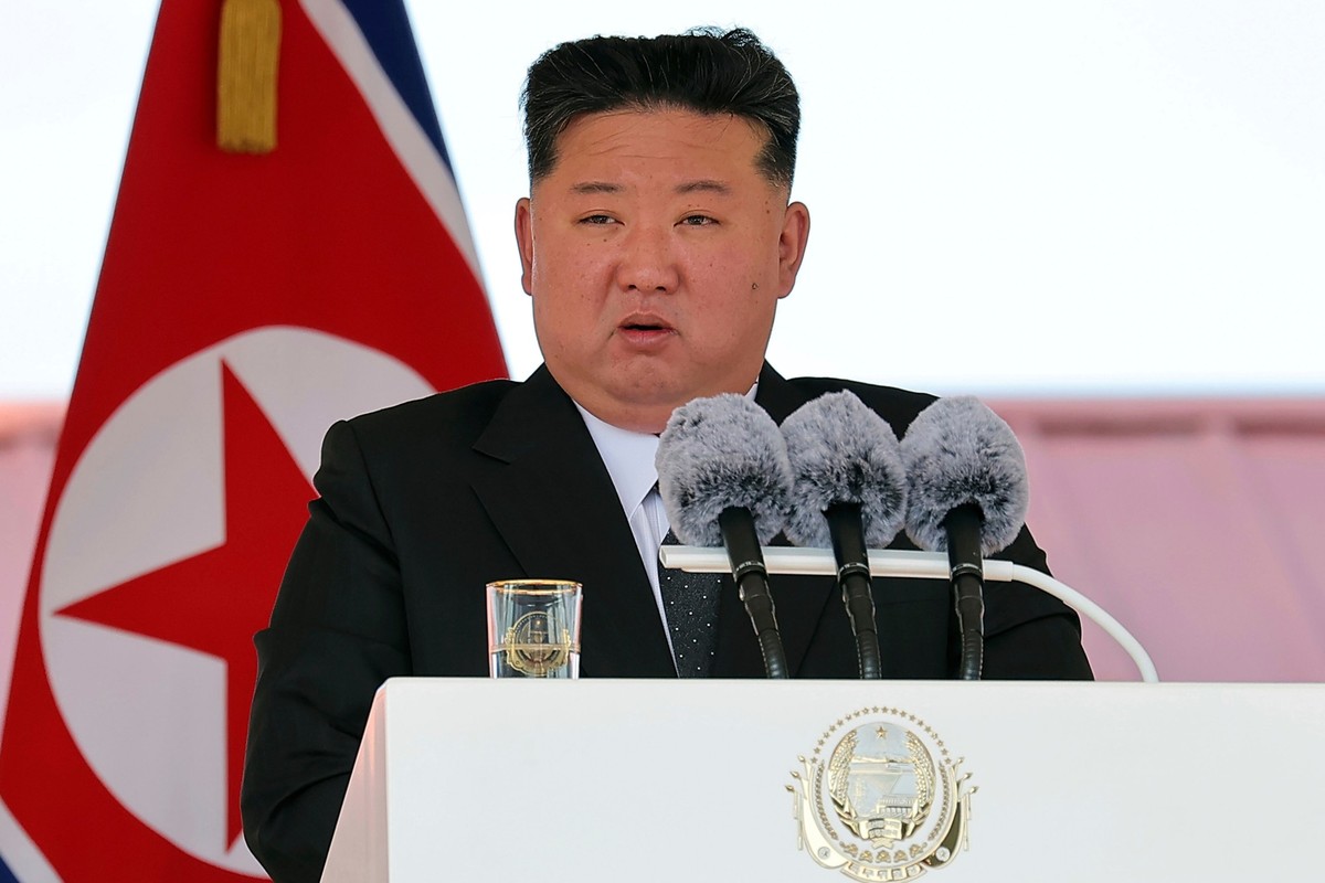 In this photo provided by the North Korean government, its leader Kim Jong Un speaks during a launch ceremony of a destroyer named Kang Kon at the Rajin shipyard in Rason, North Korea, Thursday, June  ...