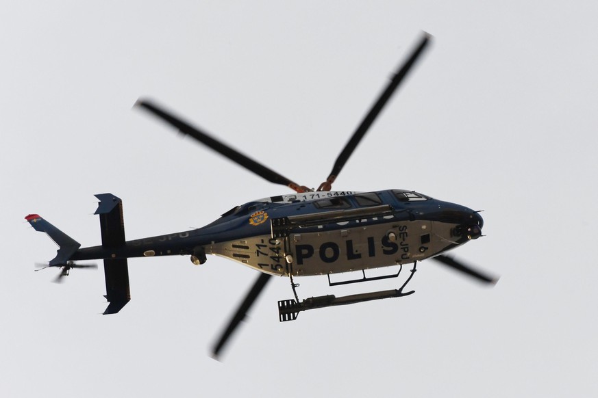 A Police helicopter flys overhead at the scene where a truck crashed into the Ahlens department store at Drottninggatan in central Stockholm, April 7, 2017. 
A truck slammed into a crowd of people out ...