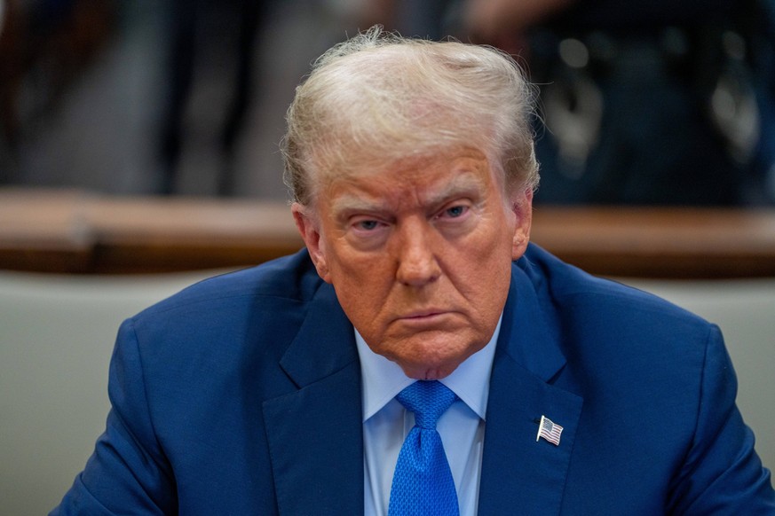 Former United States President Donald Trump waits in the courtroom on the day that he will testify in his civil fraud trial at State Supreme Court on Monday, November 6, 2023 in New York City. The cas ...