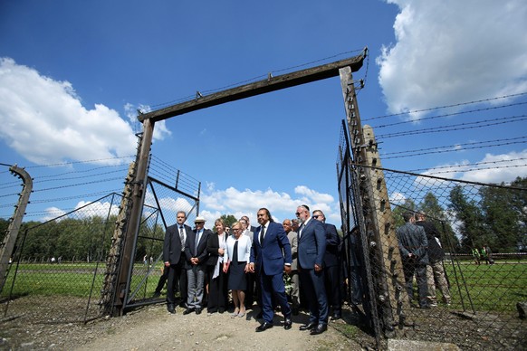 epa05451908 People attend the ceremonies marking the 72nd anniversary of the Roma Holocaust Day at the former Nazi-german extermination camp Auschwitz II-Birkenau in Brzezinka, Poland, 02 August 2016. ...