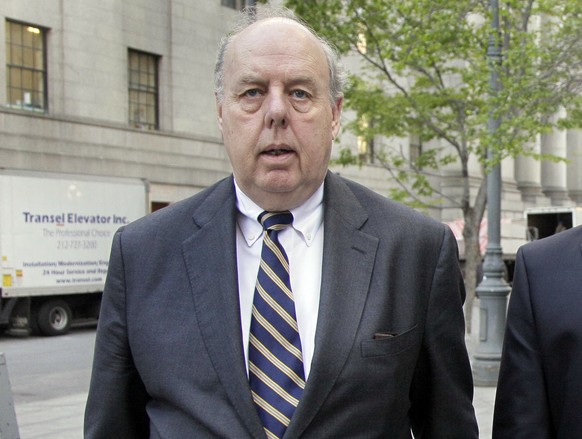 FILE - In this April 29, 20111, file photo, attorney John Dowd walks in New York. Dowd, President Donald Trump's lead lawyer in the Russia investigation has left the legal team, is confirming his deci ...