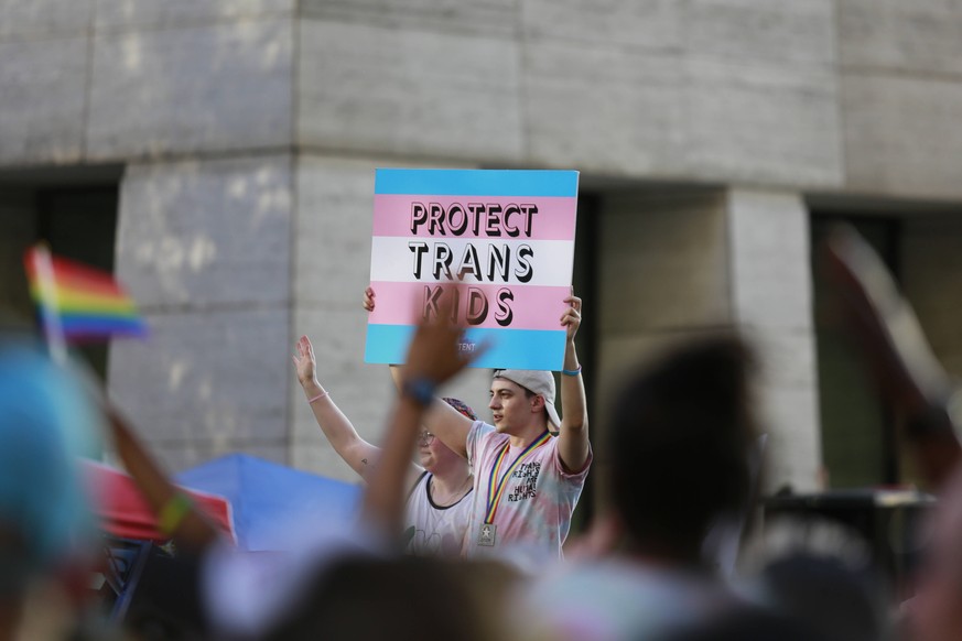 LGBT Pride Parade In Houston, Texas Houstonians gathered in downtown for the annual LGBT Pride Parade on Saturday, June 25th, 2022 in Downtown Houston. Pictured: A sign reads, Protect trans kids. Hous ...