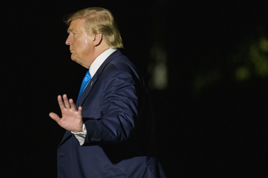 President Donald Trump waves after stepping off Marine One on the South Lawn of the White House, Wednesday, April 10, 2019, in Washington. Trump is returning from a trip to Texas. (AP Photo/Alex Brand ...