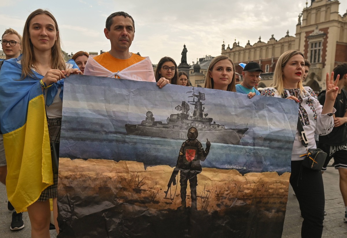 Ukraine s Independence Day Celebrated In Krakow Ukrainian people carry an image of an image of a stamp honoring defiant Ukrainian border guards on Snake Island during the Freedom March in Krakow s Mai ...