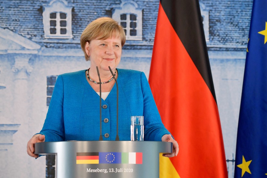 German Chancellor Angela Merkel speaks during a news conference with Italian Prime Minister Giuseppe Conte after their meeting at the German governmental guest house in Meseberg, outside Berlin, Germa ...