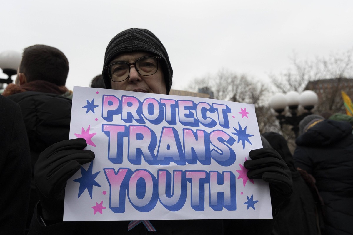 February 8, 2025, New York, New York, USA: A demonstrator holds a sign that reads PROTECT TRANS YOUTH. Approximately seven thousand people attend a rally in Union Square Park in Manhattan protesting P ...