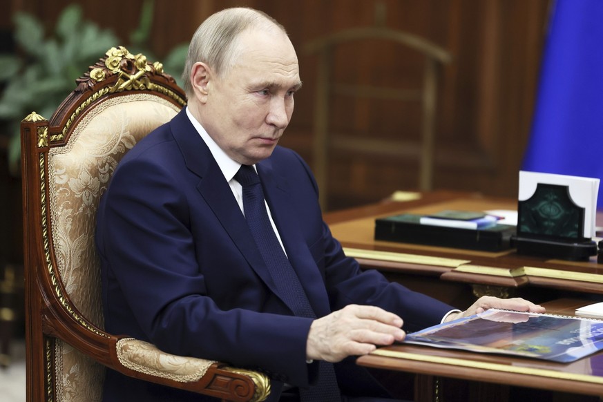 Russian President Vladimir Putin listens to the governor of Kostroma region Sergei Sitnikov during their meeting at the Kremlin in Moscow, Russia, Thursday, March 20, 2025. (Mikhail Metzel, Sputnik, K ...