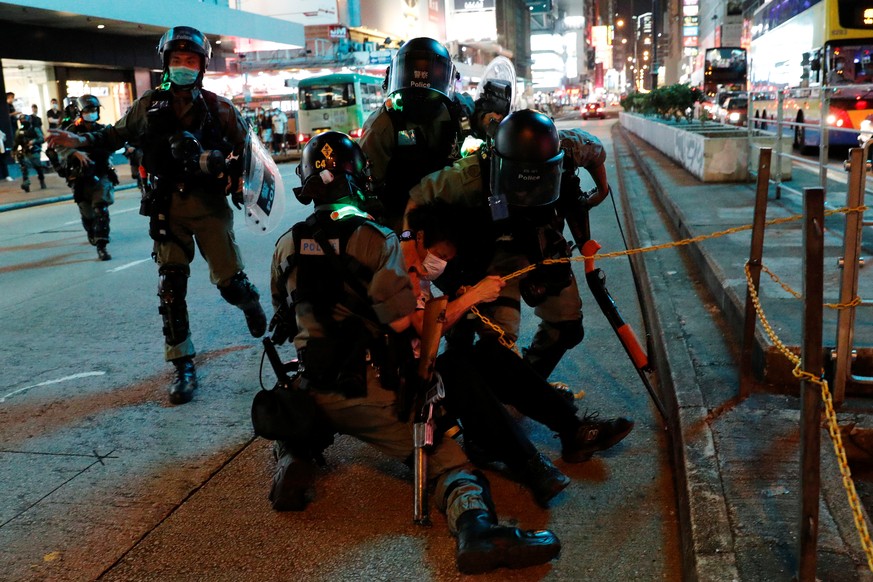 Riot police detain an anti-government protester during a protest at Mong Kok, in Hong Kong, China May 10, 2020. REUTERS/Tyrone Siu