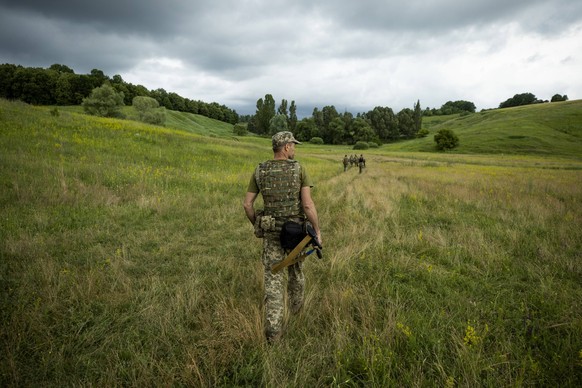 Photograph dated June 23, 2022 showing Azov Army fighters during training, outside Kharkiv, Ukraine issued 24 June 2022. For the Ukrainians they are national heroes, for the Russians a neo-Nazi militi ...