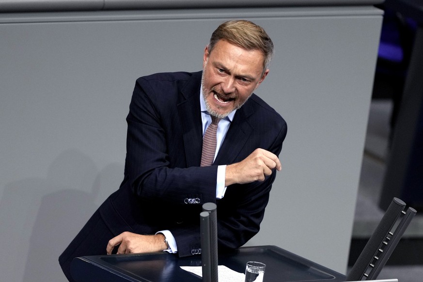 Leader of liberal FDP party Christian Lindner speaks during a plenary session at the German parliament Bundestag where he faces a vote of confidence, Berlin, Germany, Monday, Dec. 16, 2024. (AP Photo/ ...