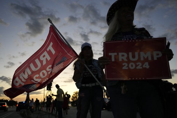 Kathy Clark of Lantana, right, and &quot;Maga&quot; Mary Kelley show their support for former President Donald Trump after the news that Trump has been indicted by a Manhattan grand jury, Thursday, Ma ...