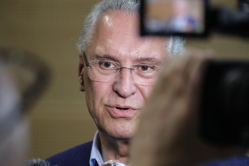 Bavarian Interior Minister Joachim Herrmann speaks with journalists during a press conference in Wuerzburg, southern Germany, on June 26, 2021, to comment on a deadly attack. - Investigators were raci ...