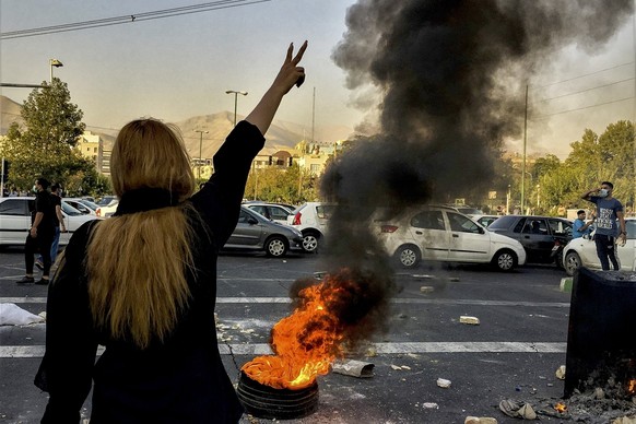 FILE - In this photo taken by an individual not employed by the Associated Press and obtained by the AP outside Iran, Iranians protests the death of 22-year-old Mahsa Amini after she was detained by t ...