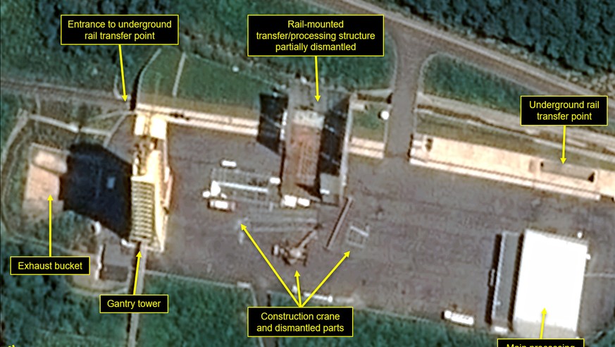 This July 22, 2018, satellite image released and annotated by 38 North on Monday, July 23, shows what the U.S. research group says is the partial dismantling of the rail-mounted transfer structure, at ...