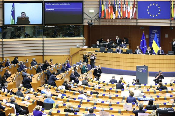 BRUSSELS, BELGIUM - MARCH 1: Ukrainian President Volodymyr Zelensky (on screen) gives a live video address during a special plenary session of the European Parliament focused on the Russian invasion o ...