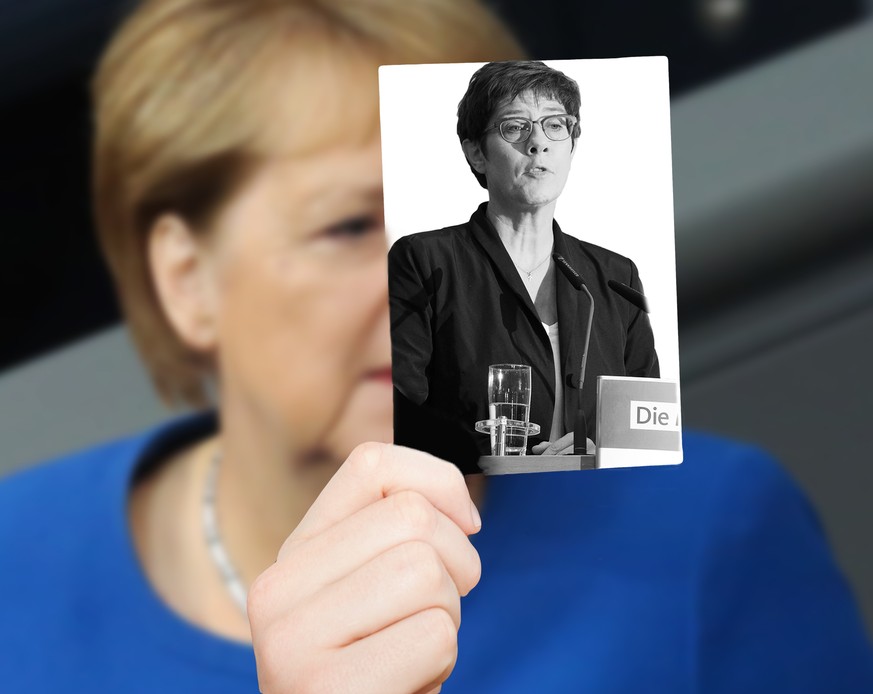 BERLIN, GERMANY - OCTOBER 17: German Chancellor Angela Merkel (CDU) prepares to speak to Bundestag members in the Reichstag, the seat of the country&#039;s federal parliament, on October 17, 2019 in B ...