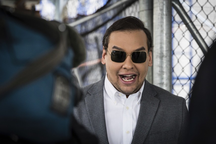 Rep. George Santos (R-N.Y.) walks past the criminal courthouse at 100 Center Street in New York on Tuesday, April 4, 2023. Former President Donald Trump, who faces multiple election-related investigat ...