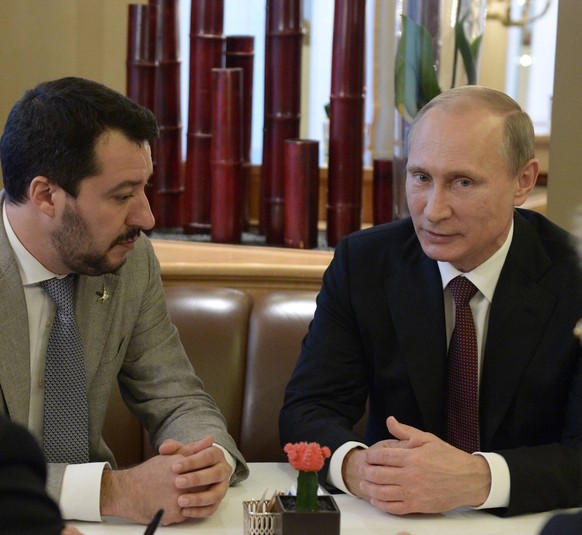 MILAN, ITALY. OCTOBER 17, 2014. Russia s president Vladimir Putin (2nd R) and Matteo Salvini (2nd L), federal secretary of Lega Nord (North League), member of the European Parliament, at a meeting on  ...
