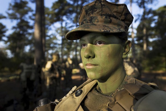 In this image provided by the U.S. Marine Corps, Pfc. Christina Fuentes Montenegro prepares to hike to her platoon&#039;s defensive position during patrol week of Infantry Training Battalion near Camp ...