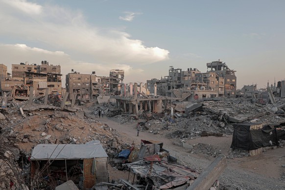 241014 -- GAZA, Oct. 14, 2024 -- Buildings destroyed by Israeli strikes are pictured in the southern Gaza Strip city of Khan Younis, on Oct. 13, 2024. Photo by /Xinhua MIDEAST-GAZA-KHAN YOUNIS-DAILY L ...