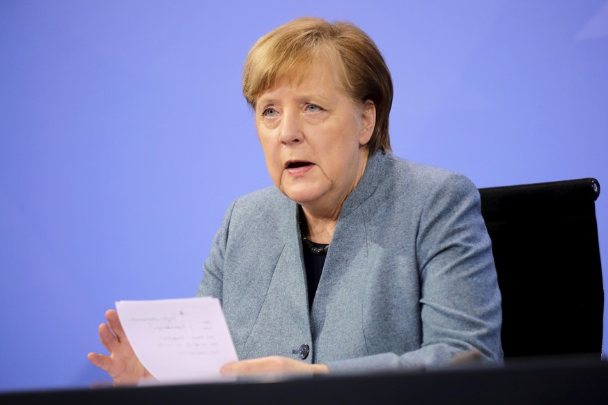 German Chancellor Angela Merkel holds a news conference after meeting with vaccine producers and Germany&#039;s state prime ministers via video conference, in Berlin, Germany, Monday Feb. 1, 2021. (Ha ...