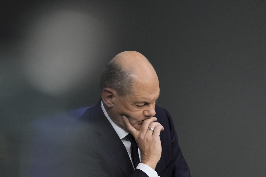FILE - German Chancellor Olaf Scholz attends a debate fter his speech at the parliament Bundestag in Berlin, Germany, on Oct. 19, 2023. With its economy already struggling, Germany now is wrestling to ...