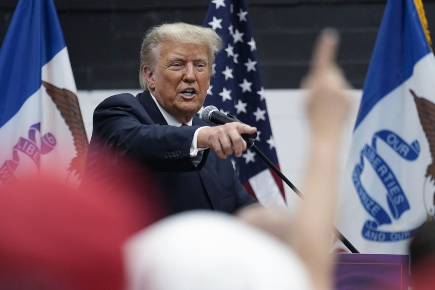 Former President Donald Trump visits with campaign volunteers at the Grimes Community Complex Park, Thursday, June 1, 2023, in Des Moines, Iowa. (AP Photo/Charlie Neibergall)