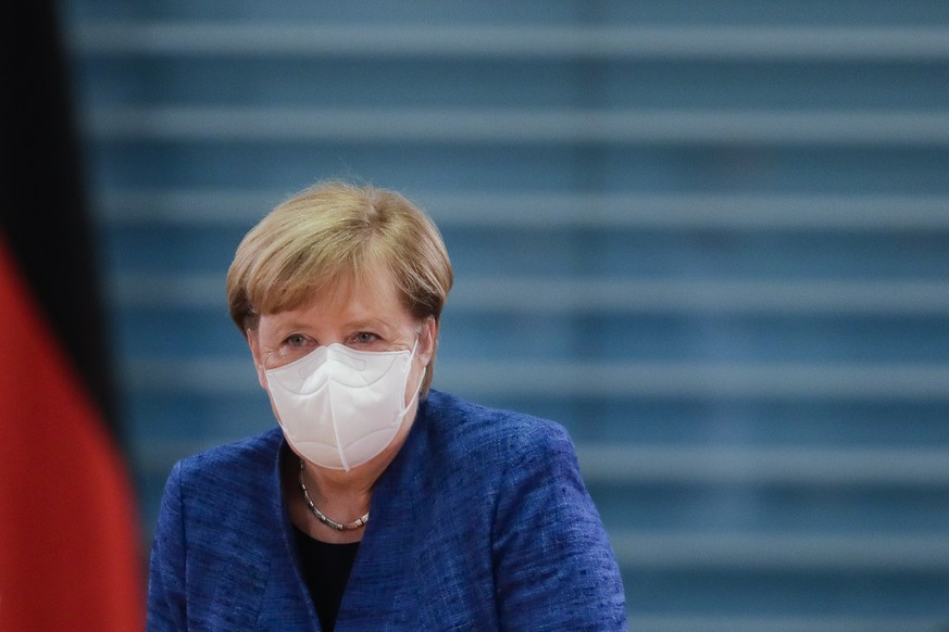 German Chancellor Angela Merkel arrives for the weekly cabinet meeting of the German government at the chancellery in Berlin, Wednesday, Oct. 21, 2020. (AP Photo/Markus Schreiber, Pool)