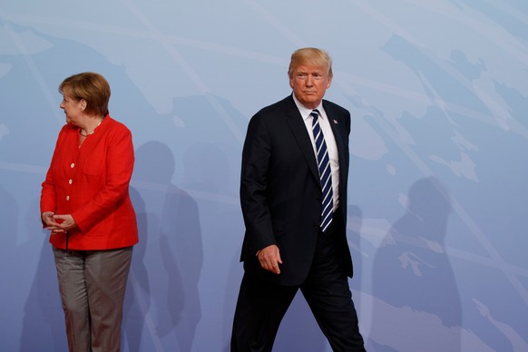 File-This July 7, 2017, file photo shows President Donald Trump walking off after being greeted by German Chancellor Angela Merkel after arriving at the G20 Summit, in Hamburg, Germany. Trump and Macr ...