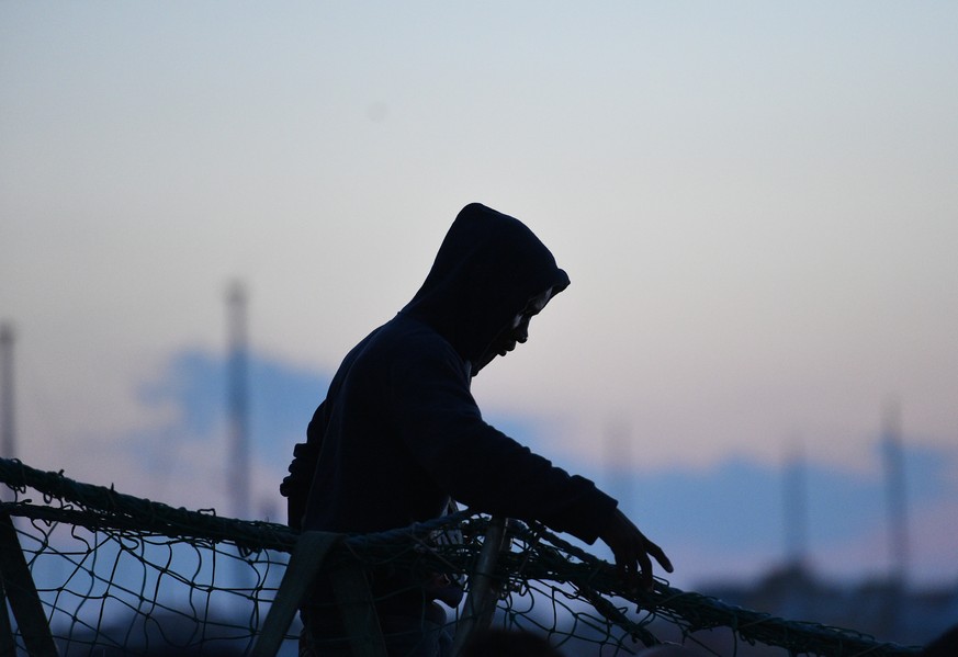 A migrant waits to disembark from the Sea-Watch 3 rescue ship in Lampedusa, Italy June 29, 2019. REUTERS/Guglielmo Mangiapane