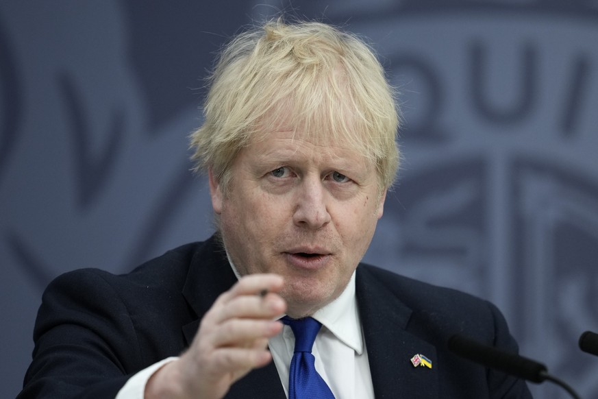 British Prime Minister Boris Johnson delivers a speech at Lydd Airport, south east England, Thursday, April 14, 2022. Britain says it has struck a deal with Rwanda to send some asylum-seekers to the c ...