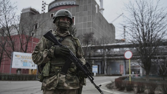 Ukraine Russia Military Operation 8136314 08.03.2022 An armed Russian serviceman is seen on the territory of the Zaporozhye nuclear power plant located in the steppe zone on the shore of the Kakhovsky ...