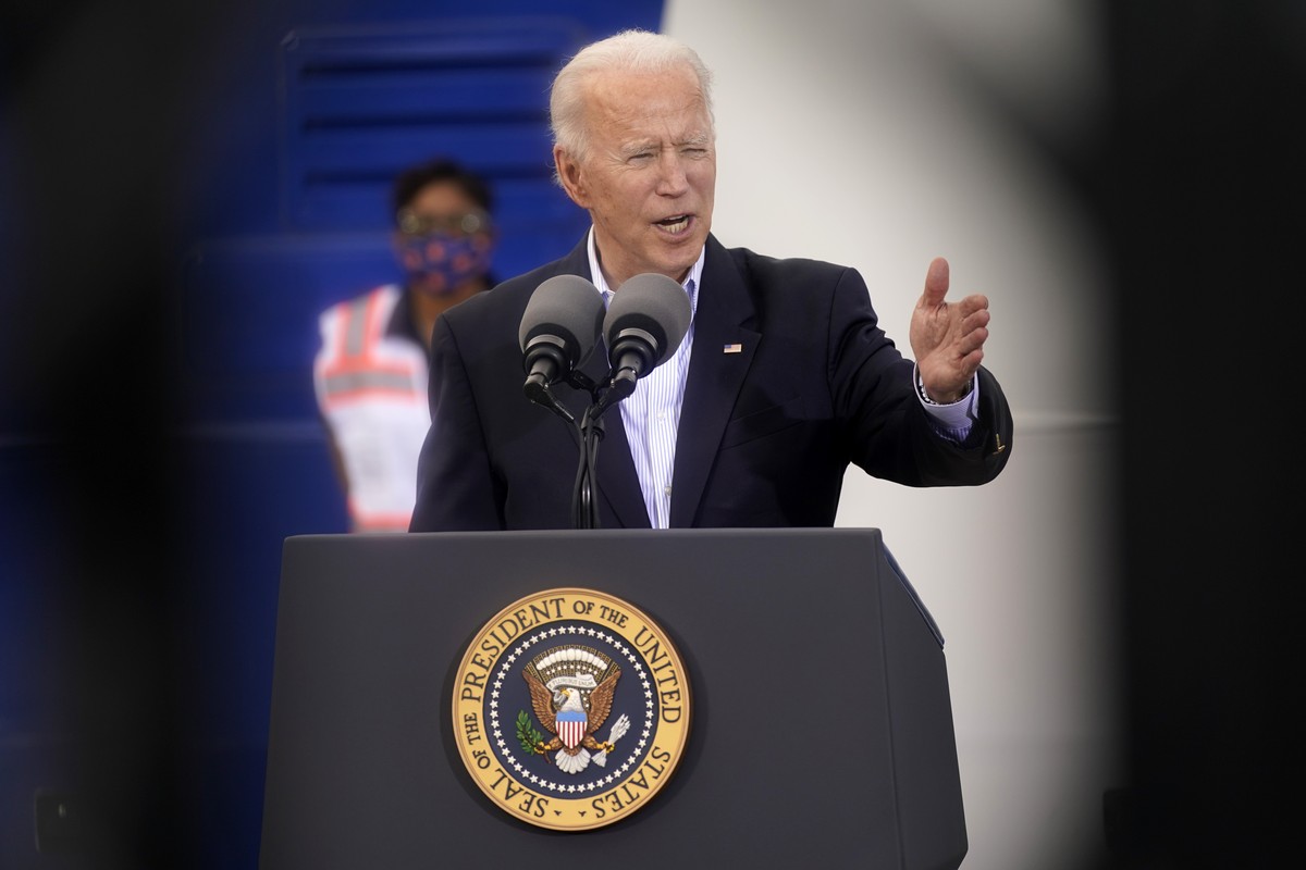 In this image taken through scaffolding, President Joe Biden speaks at a FEMA COVID-19 mass vaccination site at NRG Stadium, Friday, Feb. 26, 2021, in Houston. (AP Photo/Patrick Semansky)