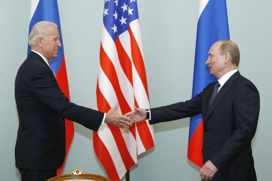 FILE - In this March 10, 2011, file photo, then Vice President Joe Biden, left, shakes hands with Russian Prime Minister Vladimir Putin in Moscow, Russia. President Joe Biden will hold a summit with V ...