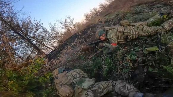 FILE - In this image from video released by the Russian Defense Ministry on Nov. 7, 2024, Russian Army soldiers fight with Ukrainian Armed forces in the Sudzhansky district of the Kursk region of Russ ...