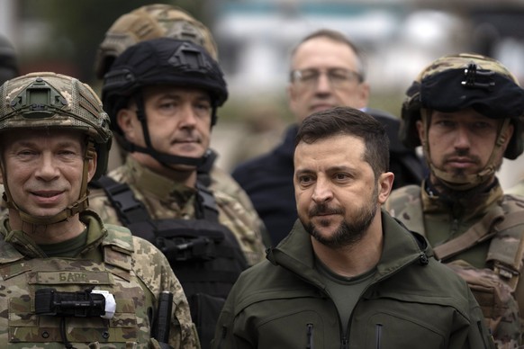 FILE - Ukrainian President Volodymyr Zelenskyy poses for a photo with soldiers after attending a flag-raising ceremony in the recaptured city of Izium, Ukraine, on Sept. 14, 2022. Zelenskyy has ruled  ...